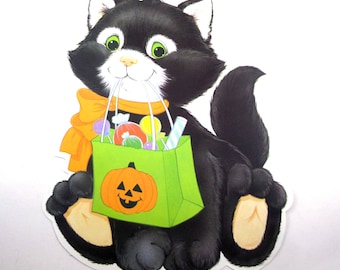 Vintage Halloween Die Cut Decoration with Black Cat Holding Bag of Candy by Eureka