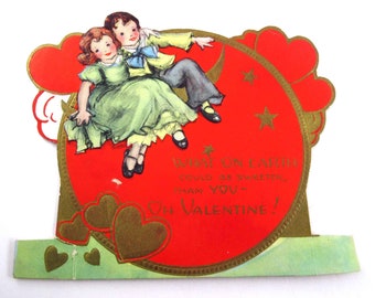 Vintage carte de Saint-Valentin en relief pour enfants avec un garçon et une fille sur la lune, quelle planète diable