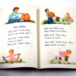 May include: Open book with illustrations. The left page shows a boy with a pumpkin and the text "Billy Works". The right page shows a boy with a pumpkin, a dog, and a girl. Text on both pages tells a story.
