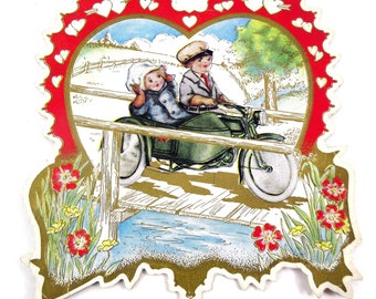 Vintage Fancy Antique Whitney Made Victorian Valentine Greeting Card with Boy and Girl on Motorcycle Gold Gilded