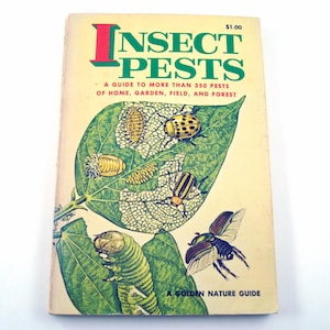 May include: A vintage book titled "Insect Pests" with a green and red title. The cover features a detailed illustration of various insects on a green leaf. The book is part of the "Golden Nature Guide" series.