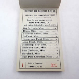May include: A vintage train ticket for the Louisville and Nashville Railroad Company. The ticket is for sixty-two trips and is valid for travel between New Orleans, Louisiana and various locations in Mississippi. The ticket number is 371.