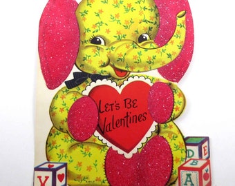 Vintage Children's Flocked and Glittered Valentine Greeting Card with Cute Pink and Blue Yellow Elephant Holding Red Heart