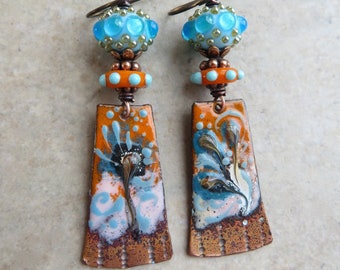 Opposites Attract ... Artisan Handpainted Enameled Copper and Glass Lampwork Earrings. Handcrafted Blue an Orange Floral Boho Earrings.