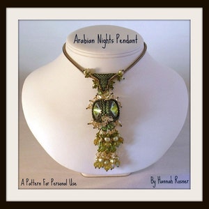 May include: A green and gold beaded pendant necklace with a large green crystal in the center. The necklace is on a white mannequin bust. The text "Arabian Nights Pendant" is above the necklace and the text "A Pattern For Personal Use" is below the necklace. The text "By Hannah Rosner" is in the bottom right corner of the image.