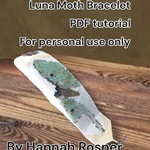May include: A white and green Luna Moth bracelet, with a PDF tutorial, is displayed on a wooden surface. The text on the image reads "Luna Moth Bracelet PDF tutorial For personal use only By Hannah Rosner."