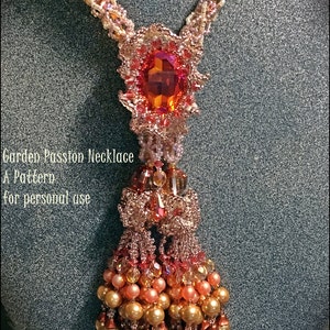 May include: A handmade necklace with a large, orange-red gemstone pendant. The necklace features intricate beadwork in shades of gold, peach, and red. The text "Garden Passion Necklace" and "A Pattern for personal use" is visible.