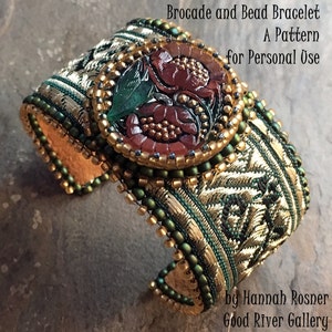 May include: A green and gold beaded bracelet with a red and gold floral design. The bracelet is made with brocade and beads. The text "Brocade and Bead Bracelet A Pattern for Personal Use by Hannah Rosner Good River Gallery" is visible on the image.