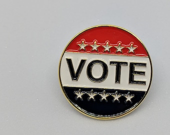 VOTE soft enamel pin.  Spread the word to get out and VOTE!  Each pin purchased includes a locking pin back!