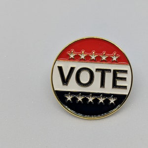 VOTE soft enamel pin.  Spread the word to get out and VOTE!  Each pin purchased includes a locking pin back!