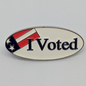 I Voted soft enamel pin. Let everyone know that you voted with a pin that will last! Secured with 2 posts so it will stay upright!