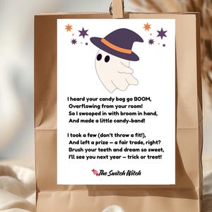 May include: A Halloween-themed print featuring a cartoon ghost wearing a witch hat, surrounded by stars. The print includes a poem about candy and a signature that reads "The Switch Witch". The print is displayed on a brown paper bag.