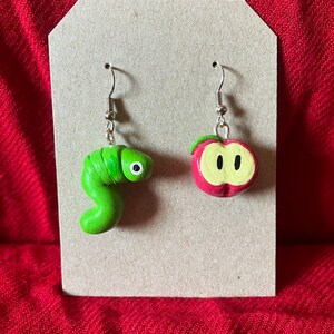 Apple and worm mismatched earrings