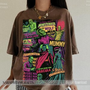 May include: Brown t-shirt featuring a colorful graphic of classic Universal Monsters. The design includes images of the Mummy, Frankenstein, Dracula, and the Wolfman, with text that reads "Monster Terror" and "Creature from the Black Lagoon."