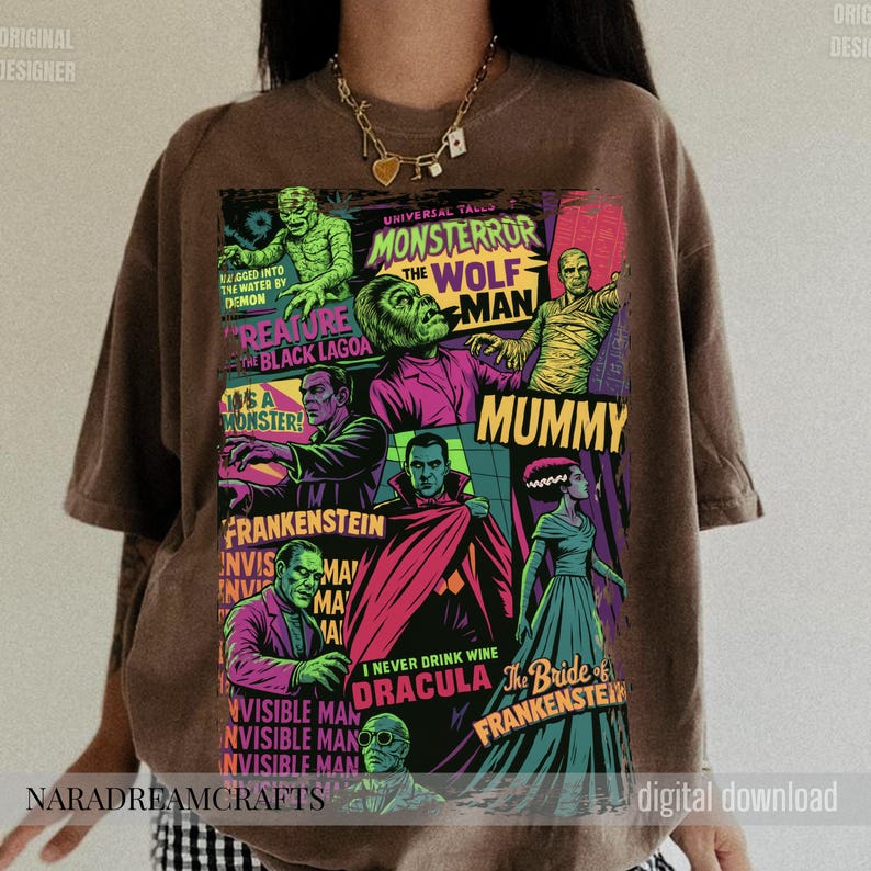 May include: Brown t-shirt featuring a colorful graphic of classic Universal Monsters. The design includes images of the Mummy, Frankenstein, Dracula, and the Wolfman, with text that reads "Monster Terror" and "Creature from the Black Lagoon."