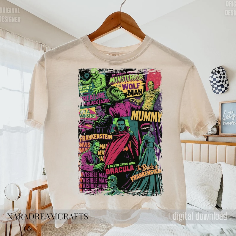 May include: Cream-colored t-shirt featuring a colorful collage of classic monster movie characters, including Frankenstein, Dracula, and the Mummy. The graphic includes the text "MONSTERROR" and "I NEVER DRINK WINE".