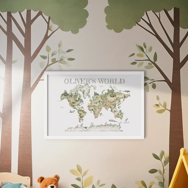 Personalized child's wall art with frame included. Watercolor style image of world map with animals throughout, shades of green and neutral tones. "OLIVER'S WORLD" at top of image and "est. 2024" at bottom right. Charming image woodland animals.