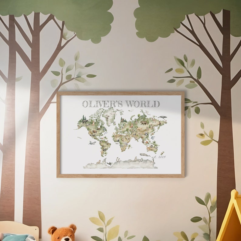 Personalized child's wall art with frame included. Watercolor style image of world map with animals throughout, shades of green and neutral tones. "OLIVER'S WORLD" at top of image and "est. 2024" at bottom right. Charming image woodland animals.