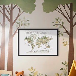 Personalized child's wall art with frame included. Watercolor style image of world map with animals throughout, shades of green and neutral tones. "OLIVER'S WORLD" at top of image and "est. 2024" at bottom right. Charming image woodland animals.