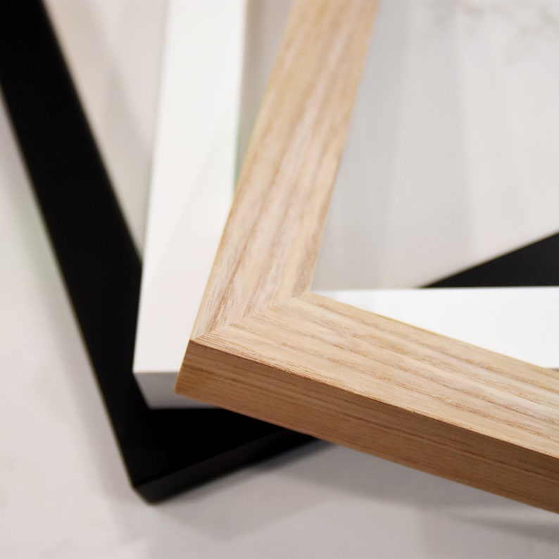 Solid wood framed art options. Shown in black, oak and white options.