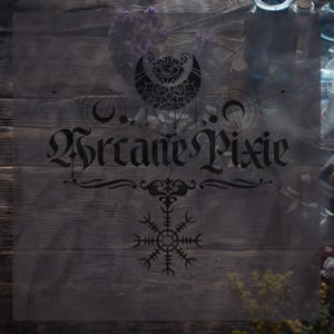 May include: A transparent overlay with the text "Arcane Pixie" in a gothic font, featuring a crescent moon and eye design, along with other mystical symbols. The background is a dark wooden surface with dried flowers and apothecary bottles.