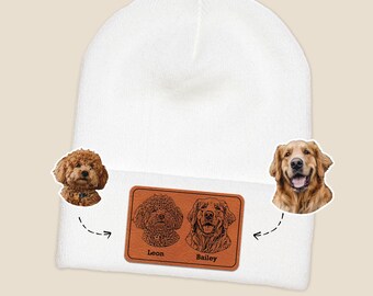 May include: White beanie with a brown leather patch featuring engraved portraits of two dogs, a poodle and a golden retriever, with the names "Leon" and "Bailey" below. The beanie is a cozy winter accessory.