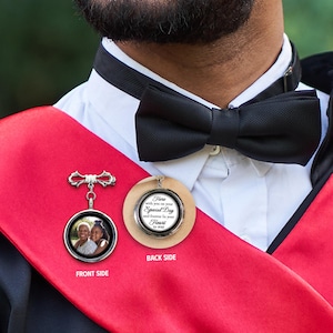 May include: A silver locket with a photo of two people on the front and a message on the back that reads "Here with you on your Special Day and forever in your Heart to stay".