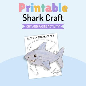 Puede incluir: Una hoja de actividades de manualidades de tiburón para imprimir con el texto "Printable Shark Craft", "CUT AND PASTE ACTIVITY" y "BUILD A SHARK CRAFT". La página incluye una gran ilustración de un tiburón azul coloreado y líneas punteadas para recortar.