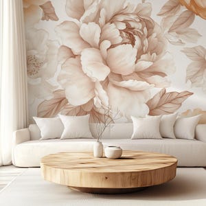 May include: A white sofa with cushions sits in front of a wall with a large floral mural. The mural features large, light brown peonies with delicate brown leaves. A wooden coffee table sits in front of the sofa.