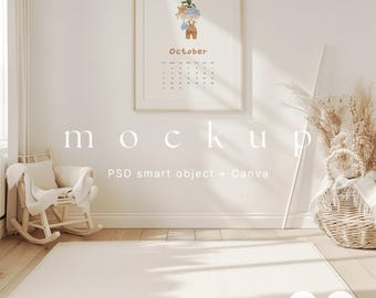 May include: A white framed calendar mockup with the word "October" and a watercolour illustration of a child in overalls. The calendar is hanging on a white wall in a room with a rocking chair and a wicker basket filled with dried pampas grass.