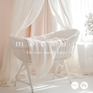 May include: White wicker bassinet with a white blanket and a pink pillow inside. The bassinet is sitting on a white floor with a white sheer curtain in the background.
