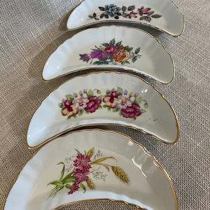 Chadwick Set of Four Cresent Bone Dishes each with a Different Floral Pattern