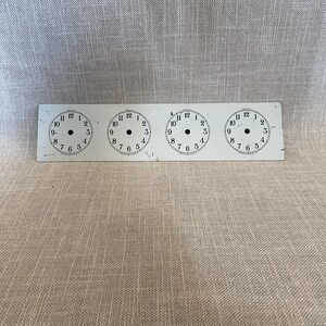 Four Industrial Clock Faces on One Panel
