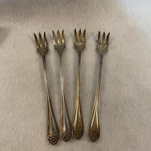 Four New Daisy Pattern Silverplate Cocktail Forks - 1910