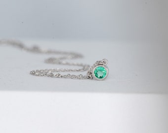 May Birthstone Emerald and White Gold Round Bezel Solitaire Necklace