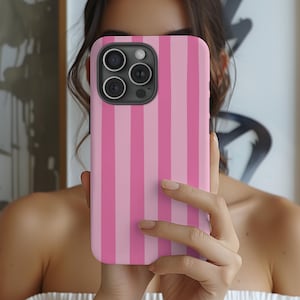 May include: Pink and white striped phone case for an iPhone.