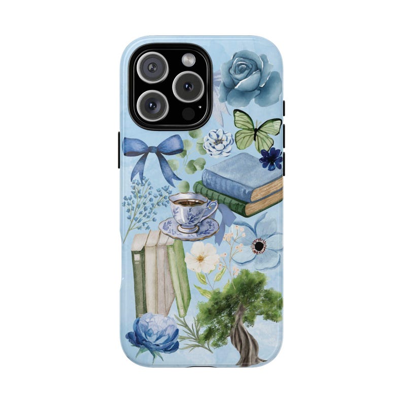 May include: A blue and white phone case with a floral design. The design includes a cup of tea, books, flowers, and a butterfly. The phone case is for an iPhone 13 Pro Max.