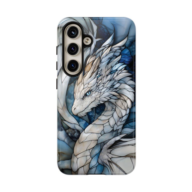 May include: A phone case featuring a white dragon with blue accents. The dragon is depicted in a stained glass style with intricate details.