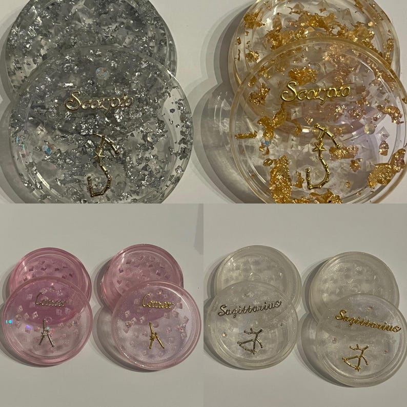 May include: Four clear resin containers with gold and silver glitter. Each container has a zodiac sign and name printed on the lid. The signs are Sagittarius, Scorpio, Gemini, and Cancer.