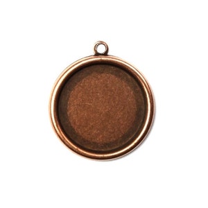 May include: A round copper pendant with a smooth, slightly textured surface. The pendant has a loop at the top for attaching a chain or cord.
