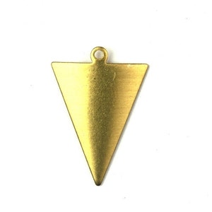 May include: A gold triangle pendant with a loop at the top for attaching to a chain or cord.