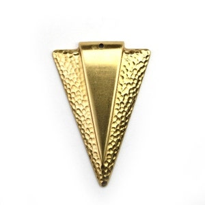 May include: A gold-toned triangle pendant with a hammered texture. The pendant has a small hole at the top for hanging.