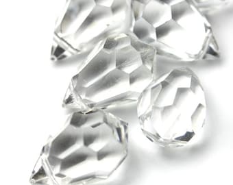 May include: A group of six clear crystal teardrop-shaped pendants with faceted surfaces.
