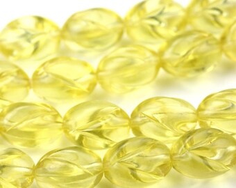 May include: A strand of yellow faceted beads. The beads are oval shaped and have a translucent appearance.