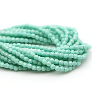 Perles de verre tchèques, polies au feu, rondes facettées 2 mm, suédée, or turquoise (50) CZF969