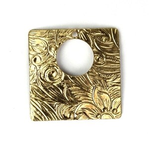 May include: A gold square pendant with a floral design and a round hole in the center.
