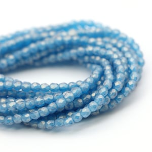 Perles de verre tchèques, polies au feu, rondes facettées 2 mm, suédée, bleu capri (50) CZF952