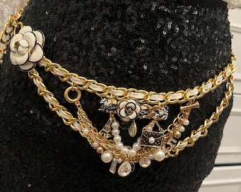 Gold chain waist belts handmade with mini charms etched in camellia flowers and pearls.