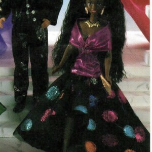 May include: A doll in a black gown with colourful polka dots and a pink top. The doll has long black hair and gold jewellery. Another doll is in a black tuxedo with a bow tie.