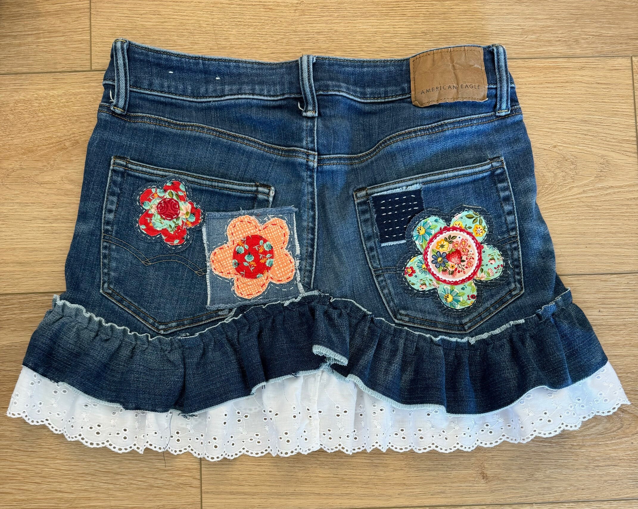 DENIM LIKE FLOWER SKIRT Denim skirt with flower print GATE